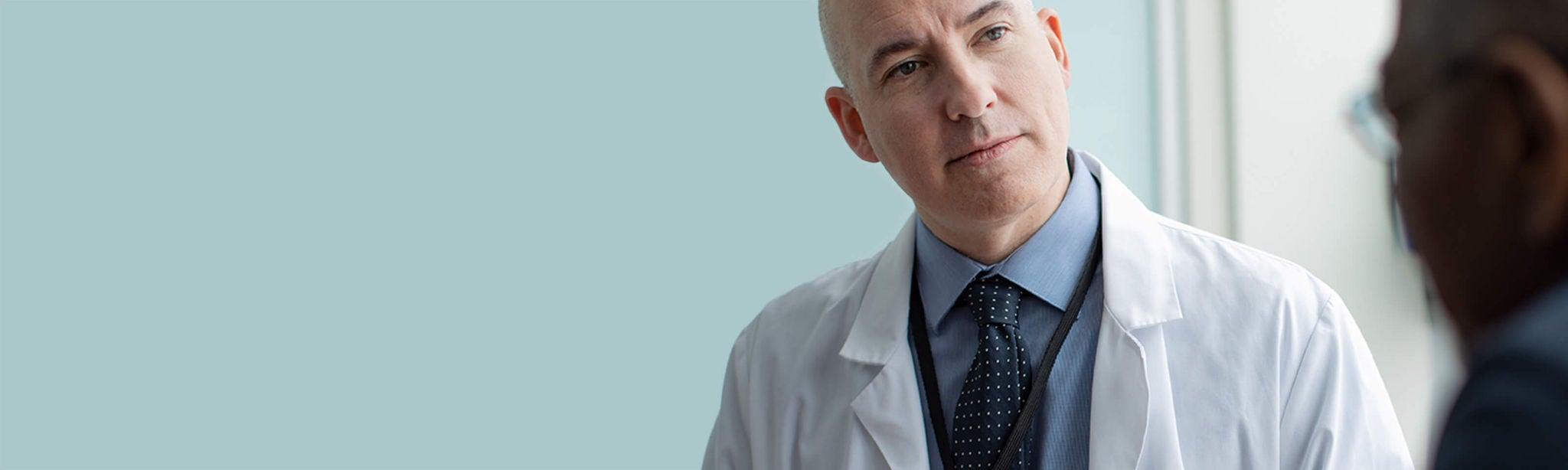 Physician listening to a patient.