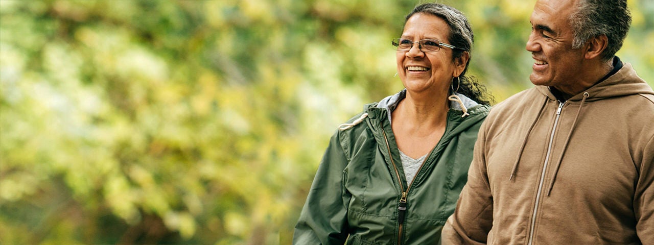 Middle-aged couple outdoors.